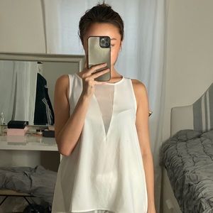 sheer white top with details